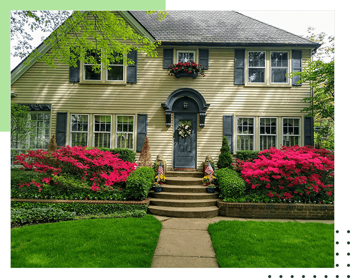 A house with flowers in front of it